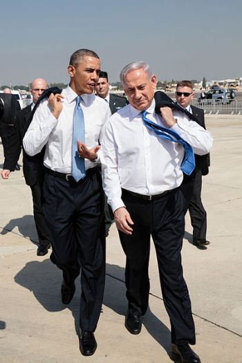 U.S. President Barack Obama talks with Israeli Prime Minister Benjamin Netanyahu as they walk across the tarmac at Ben Gurion International Airport in Tel Aviv, Israel, on Mar. 20, 2013. Credit: White House Photo, Pete Souza