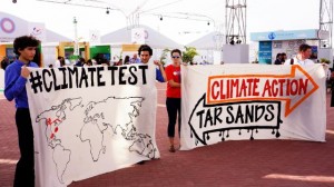 Young protesters at the U.N. climate talks in Lima, Peru highlight out-of-touch North American energy policies. Credit: Adopt a Negotiator.