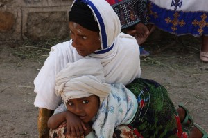 Woman and child outside a Gonder church with crosses marked in ash on foreheads. Credit: James Jeffrey/IPS