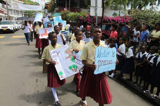 World Water Week - Primary School students in Grenada are seen here working together to promote awareness on water conservation on World Water Day. Credit: Global Water Partnership