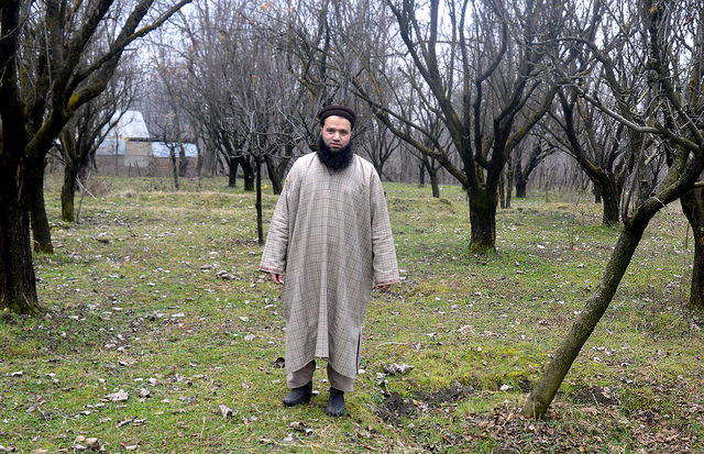 Javaid Ahmad Hurra at his small orchard in central Kashmir’s Ganderbal area. Credit: Umer Asif/IPS