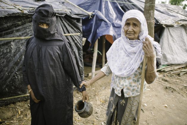 Rohingya women of Balukhali camp embarking on the trek to the toilets. Credit: Umer Aiman Khan/IPS