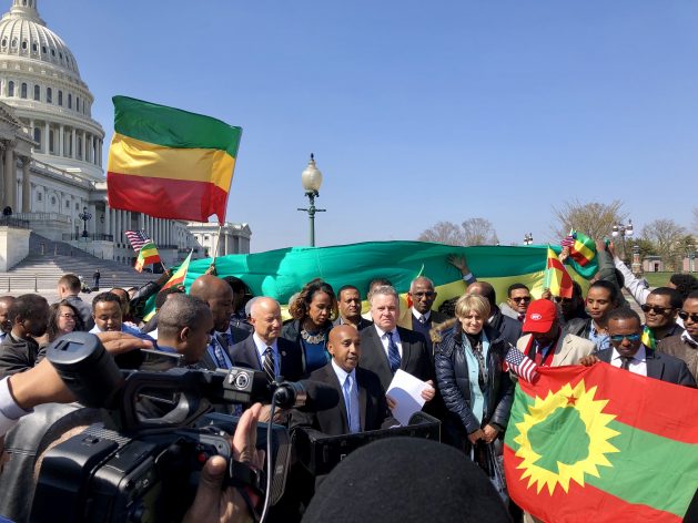 Tewodrose Tirfe, chair of the Amhara Association of America, addresses press and supporters outside Washington’s Capitol Building after passage of House Resolution-128. Behind and to his left is Congressman Chris Smith and behind and to his right is Congressman Mike Coffman, both of whom played key roles in the resolution’s successful passage. Photo courtesy Tewodrose Tirfe/Congressman Mike Coffman’s office.