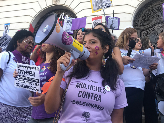 A young woman takes part in a demonstration in the city of Rio de Janeiro, wearing a T-shirt with the message: "Women against (Jair) Bolsonaro". Women led the fight against the now president of Brazil during the election campaign, with the slogan #ÉlNo (not him). Credit: Fabiana Frayssinet/IPS