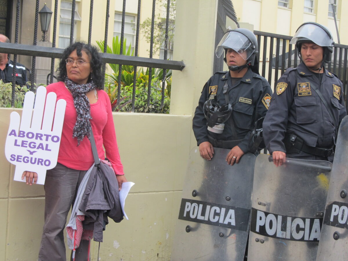 Peruvian sociologist Cecilia Olea, a member of the Articulación Feminista Marcosur (AFM), which brings together feminist networks from 11 Latin American countries, takes part in a demonstration outside the Peruvian Health Ministry in Lima, demanding reproductive rights. CREDIT: Mariela Jara/IPS