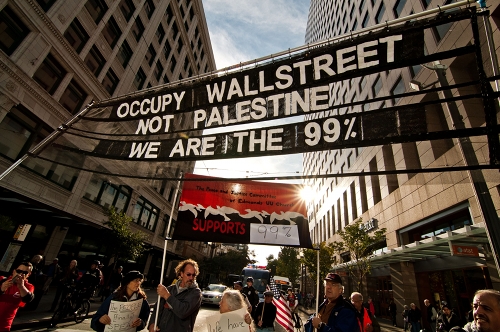Demonstrators with the Occupy Seattle Movement march through downtown, ending with a rally in front of the Bank of America headquarters.  / Credit: Tyler Stringfellow/IPS