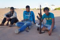 Young militia members in Kufra. / Credit:Rebecca Murray/IPS.