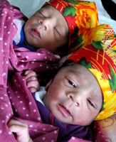 Like these
newly born twins, more children are born daily into families who can
barely afford to raise a child. / Credit:Zofeen Ebrahim/IPS