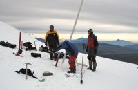 Scientists take samples from the Antisana glacier. In the background is the active Cotopaxi volcano. / Credit:Courtesy of Bernard Francou/IRD
