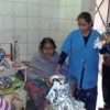 Nurse Amita Dhaka distributes food provided for patients and their attendants by the Santhigiri charity at the Rural Medicare Society hospital. Credit: Ranjit Devraj/IPS