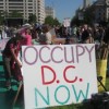 The crowd at Freedom Plaza on Thursday afternoon was over 1,000-strong, a mass of colourful posters, T-shirts and homemade flags. Credit: Amanda Wilson and Rosemary D