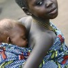 A young girl carrying a baby in a village in DRC. MONUC, Lake Albert Patrolling Mission. Credit: UN Photo/Martine Perret