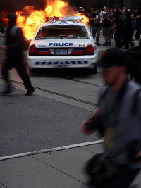 A police car burns at last year's G20 summit in Toronto, Canada. Credit:  Marty Olauson/IPS