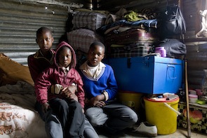 Orphans Moliehi (17), Lefa (9) and Ithabeleng (15) live by themselves in a small shack.  Credit: Kristin Palitza/IPS