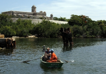 Fishermen in Cienfuegos Bay in the south of the island, where the sea level could rise 25 cm by 2050 and up to one metre by 2100.  Credit: Jorge Luis Baños/IPS