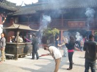 Young Shanghainese flock to the city's old temple Chenghuangmiao to pray for luck.  Credit: Antoaneta Becker/IPS.