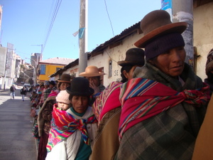 Indigenous women from the Andes, like these women queuing up in a village in Peru's Puno region, require budgets and aid with a gender focus. Credit: Milagros Salazar/IPS