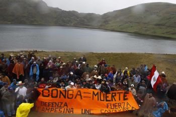 Local residents opposed to the Conga gold mine hold a vigil at one of the lakes that the project would affect in the highlands of Cajamarca.  Credit: Courtesy of the La República newspaper