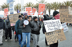 Occupy members shut down the port of Oakland, protesting its control by the "one percent".  Credit: Judith Scherr/ IPS