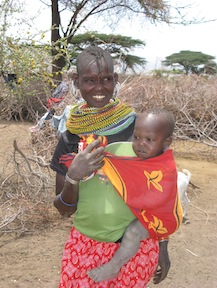 A pregnant woman in Kenya's North Eastern Province with one of her children. Overpopulation in the area contributes to poor maternal health.  Credit: Isaiah Esipisu/IPS