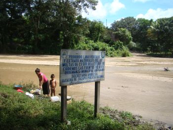 Local residents continue to use water from the depleted Coco River, despite the signs prohibiting it. Credit: Courtesy of UNOPS Local residents continue to use water from the depleted Coco River, despite the signs prohibiting it. Credit: Courtesy of UNOPS