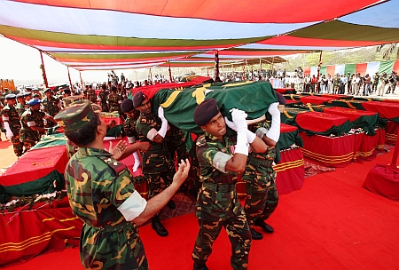 Coffins of the 57 army officers killed in an armed forces mutiny in 2009.  Credit: Shafiqul Alam Kiron/IPS 