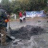 Clean-up crew at the site of a bonfire in a square in Coyhaique, the capital of Aysén. Credit: Movimiento Social por la Región de Aysén