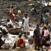 Dozens of women and children were digging into the earth in a dried out watering hole, in the Jamam refugee camp in South Sudan,in search of water. Credit: Jared Ferrie/IPS