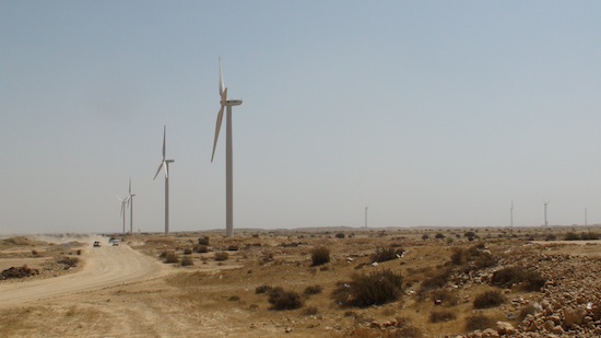 Over a dozen huge windmills line the roadside of the town of Jhimpir, close to Karachi, in the Sindh province.  Credit:  Farooq Ahmed/IPS
