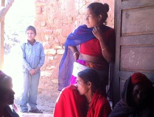 Battered Nepali women catch a moment together.  Credit: Naresh Newar/IPS