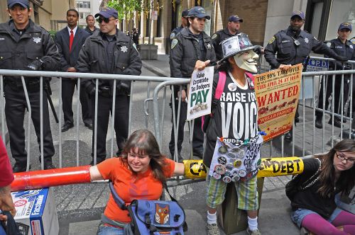 Protesters targeted what they said was Wells Fargo's high rate of foreclosure and predatory lending practices, among other things. Credit: Judith Scherr/IPS