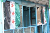 A shop window in Tripoli in Lebanon marked by bullet holes after sectarian fighting over the Syrian revolution.  Credit: Zak Brophy/IPS.