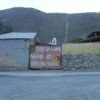 "Bread today, hunger tomorrow" - anti-mine graffiti.  Credit: Daniela Estrada/IPS