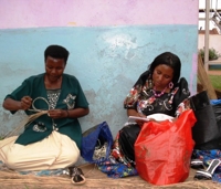 Women weaving baskets for a fair trade export business in Kampala, Uganda. Credit:  Wambi Michael/IPS