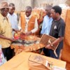 Vincent Musubire (wearing hat) and local young designers show some of their bark cloth products. Credit:  Wambi Michael/IPS