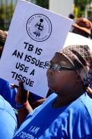 Women protests against lack of TB services during a march to parliament in Cape Town, South Africa on World TB Day. Credit:  Miriam Mannak/IPS