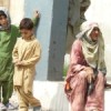 Johar Bibi, 60, in Kacha Garhi camp in Peshawar. She says she left Dir with her grandchildren (in the picture) before the launch of military operations against Taliban militants on Apr 26. Credit:  Ashfaq Yusufzai/IPS