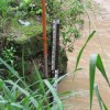 A water gauge and sensor in the Las Ciebas River on the outskirts of Neiva, which send water level data over radio waves. Credit: Courtesy of FAO