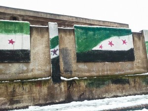 A Syrian independence flag painted on on a government school wall. Credit: Freedom House/ CC by 2.0