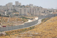 The Shuafat refugee camp can be seen across the separation wall from the Israeli settlement Pisgat Ze'ev. Credit: Jillian Kestler-D’Amours/IPS