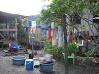 There are many demands on a communal water tap in the Lord Howe Settlement in Honiara in the Solomon Islands. Credit: Catherine Wilson/IPS.