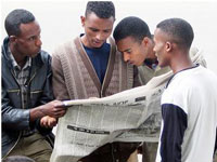 Newspapers in Ethiopia are an important source of news for people like these young men on a street in Addis Ababa. Credit: Terje S. Skjerdal/CC BY 2.0