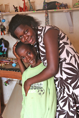 Healing hug: Counsellor Cathy Kakande empowers HIV-positive children with medicine, information and lots of love. Credit: Amy Fallon/IPS