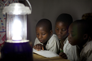 Children study in the evening thanks to a solar-powered lantern in the village of Chekeleni, southern Tanzania. Credit: Ben Langdon/VSO