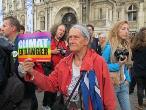 Citizen carrying a succinct CLIMATE IN DANGER warning at the People’s Climate March in Paris, Sep. 21, 2014. Credit: A.D. McKenzie/IPS