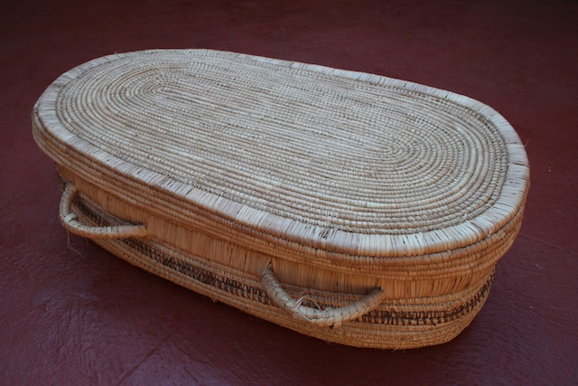 Members of the Lupane Women’s Centre hope to market these ‘eco coffins’, biodegradable caskets made from local materials, to ensure their community is sustainable, even in death. Credit: Credit: Busani Bafana/IPS