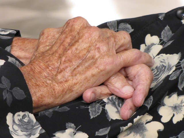 The still hands of América Herrera, a victim of what experts call patrimonial violence against older adults, when they are stripped of their assets and property by means of deceit. The new Inter-American Convention on Protecting the Human Rights of Older Persons attempts to address such problems. Credit: Maricel Sequeira/IPS