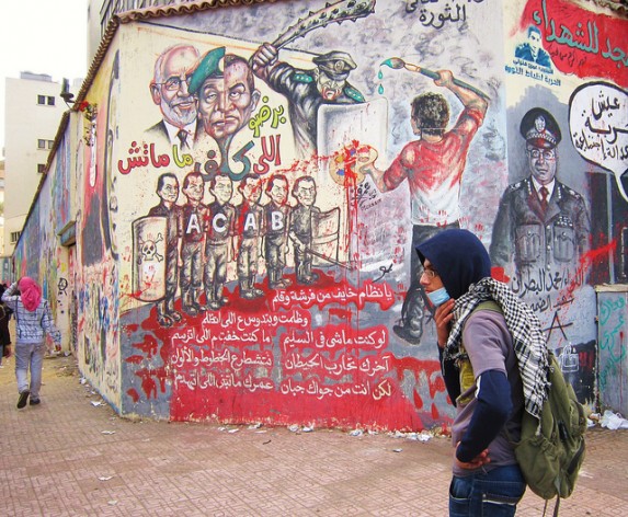 Grafitti in Cairo showing police brutality. Credit: Cam McGrath/IPS