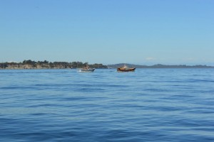 Fishing boats crossing the Chacao Channel off the coast of the Greater Island of Chiloé in Chile’s southern Los Lagos region. Credit: Claudio Riquelme/IPS