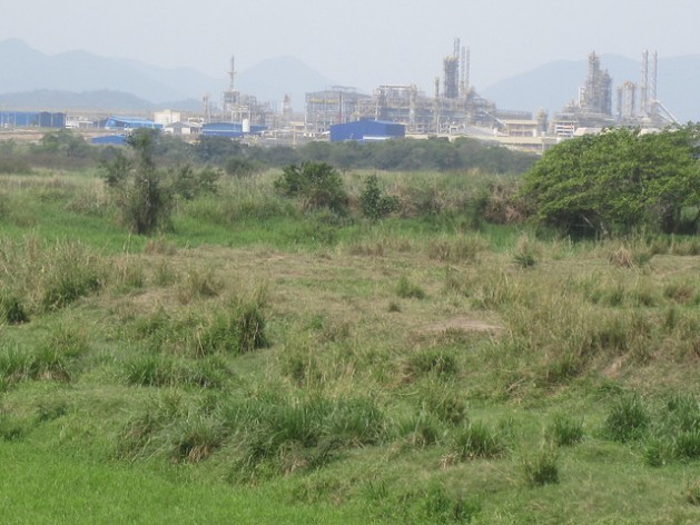 Part of the Rio de Janeiro Petrochemical Complex (COMPERJ) in October, seen from the banks of the Caceribu river, the closest to the installations that the public can get. Credit: Mario Osava/IPS
